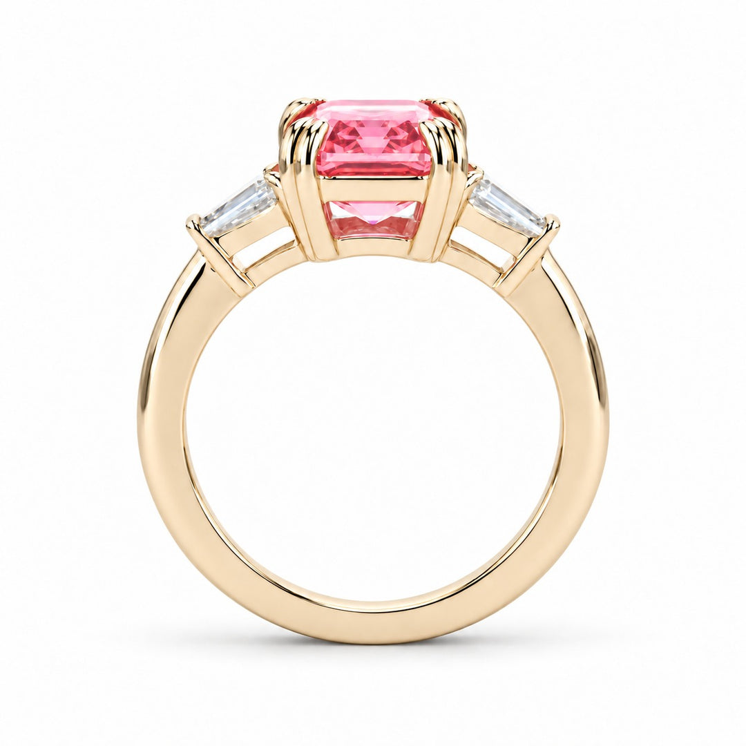 The Lumen pink lab sapphire baguette ring in 14K yellow gold, profile view