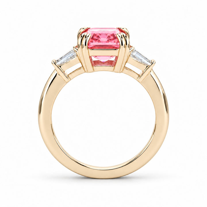 The Lumen pink lab sapphire baguette ring in 14K yellow gold, profile view