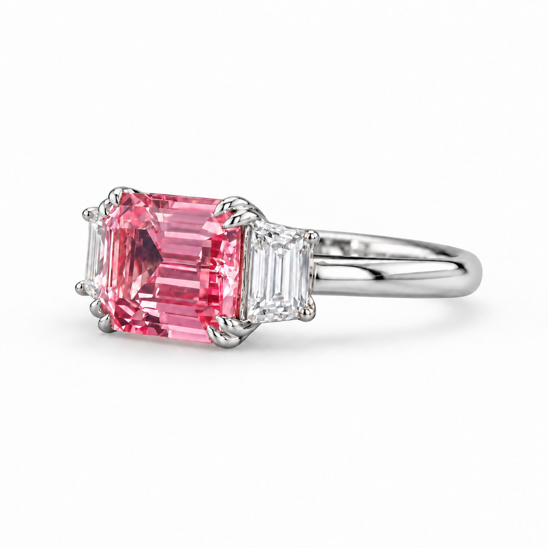 The Maribel pink lab sapphire three-stone ring in platinum, angled view