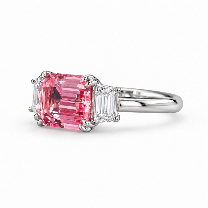 The Maribel pink lab sapphire three-stone ring in platinum, angled view