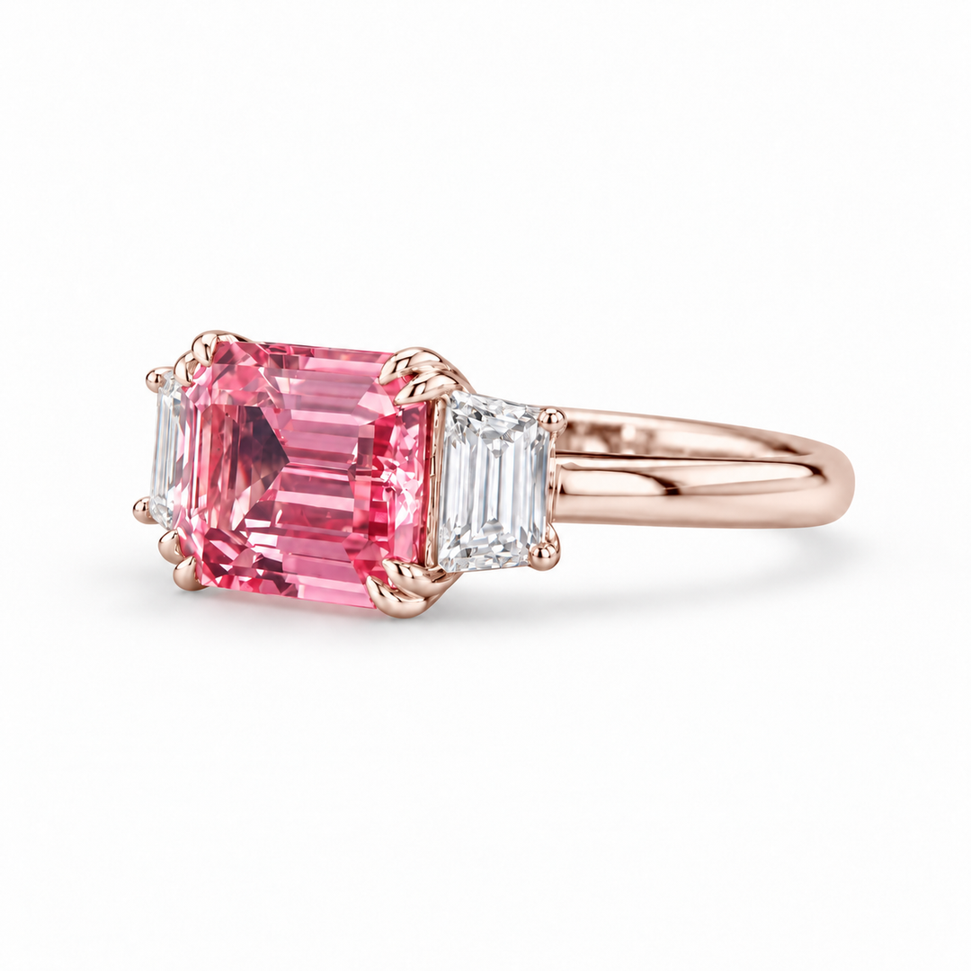 The Maribel pink lab sapphire three-stone ring in 14K rose gold, angled view