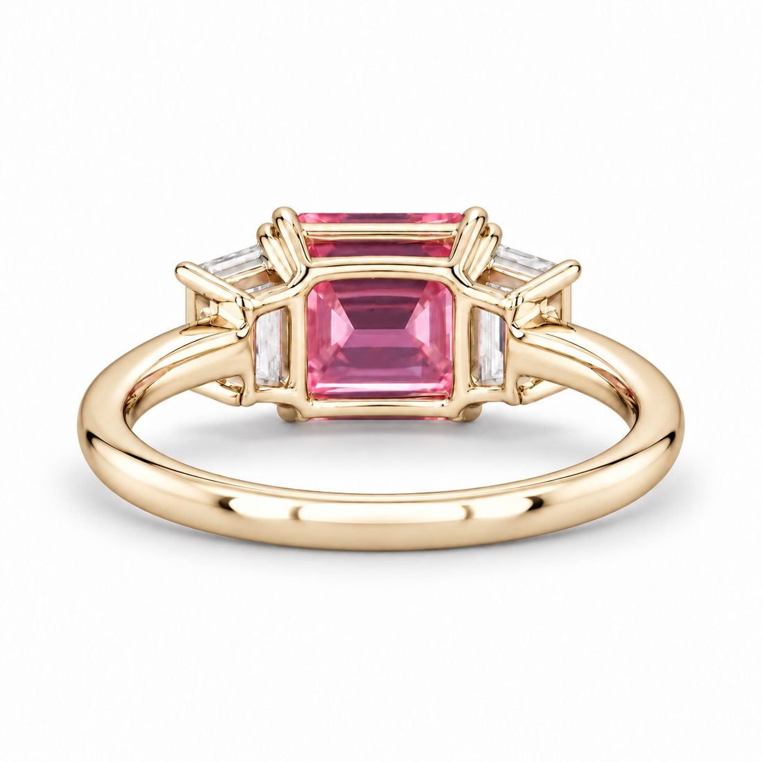 The Maribel pink lab sapphire three-stone ring in 14K yellow gold, back view