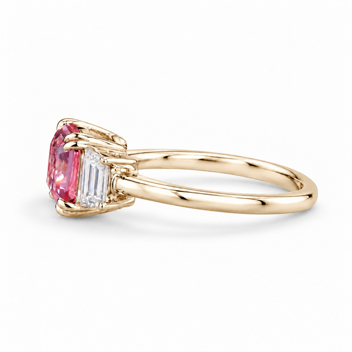 The Maribel pink lab sapphire three-stone ring in 14K yellow gold, side view
