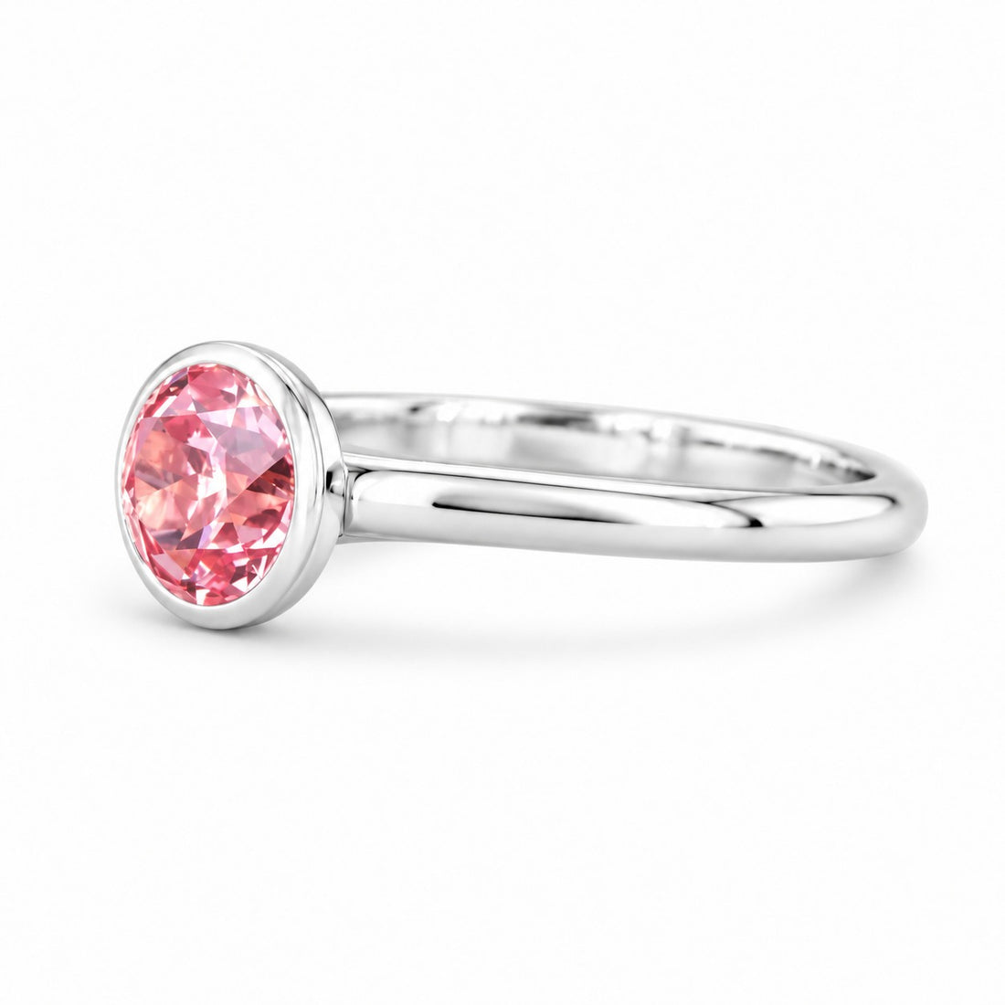 The Lune pink lab sapphire bezel solitaire ring in 14K white gold, angled view