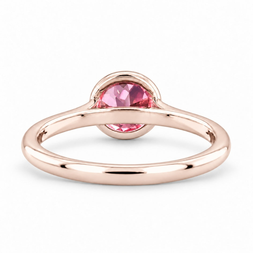 The Lune pink lab sapphire bezel solitaire ring in 14K rose gold, back view