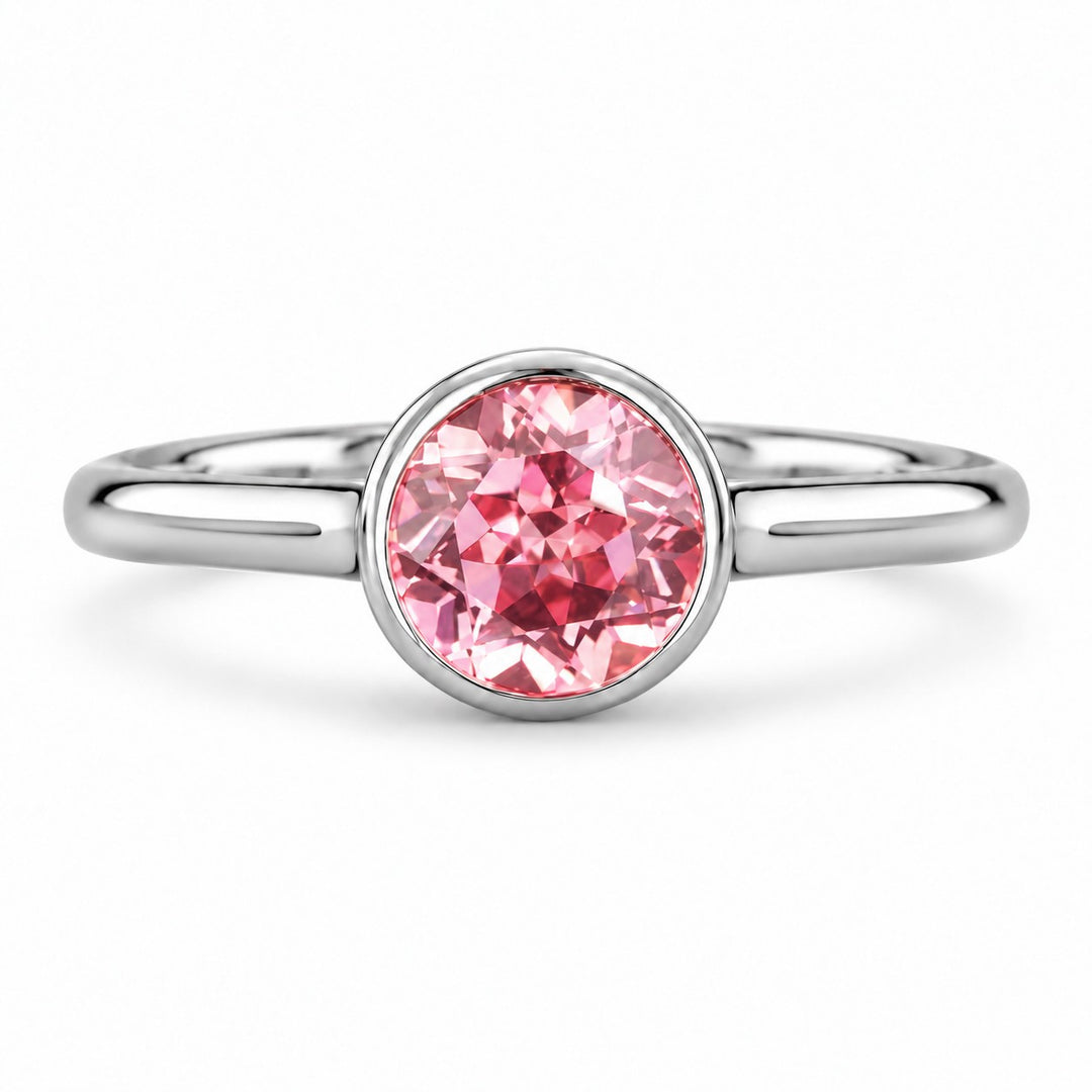 The Lune — Pink Round Sapphire Bezel Solitaire Ring in platinum, front view