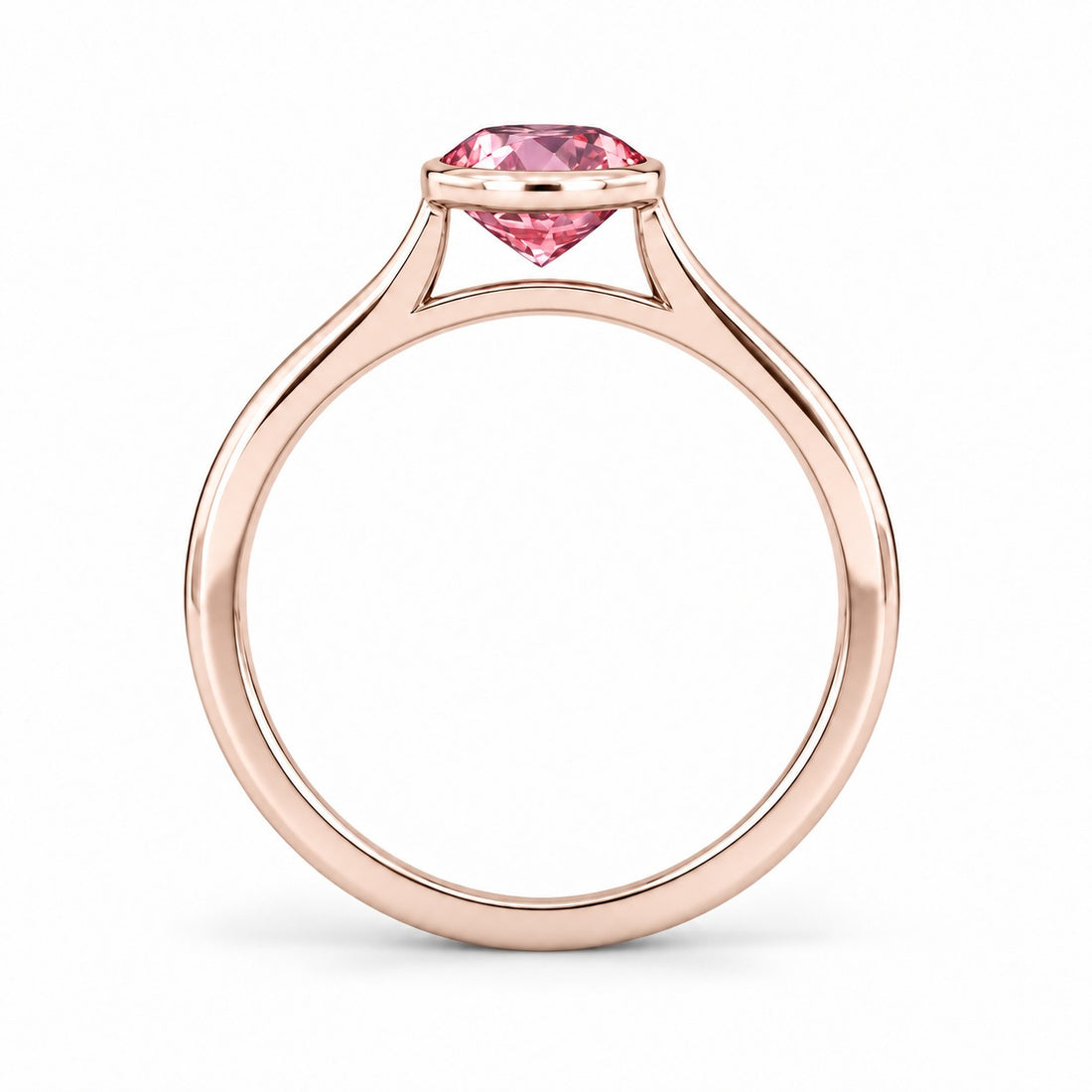 The Lune pink lab sapphire bezel solitaire ring in 14K rose gold, profile view