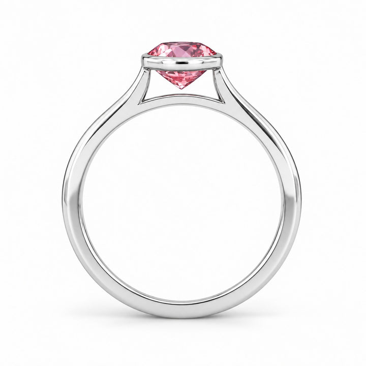 The Lune pink lab sapphire bezel solitaire ring in 14K white gold, profile view