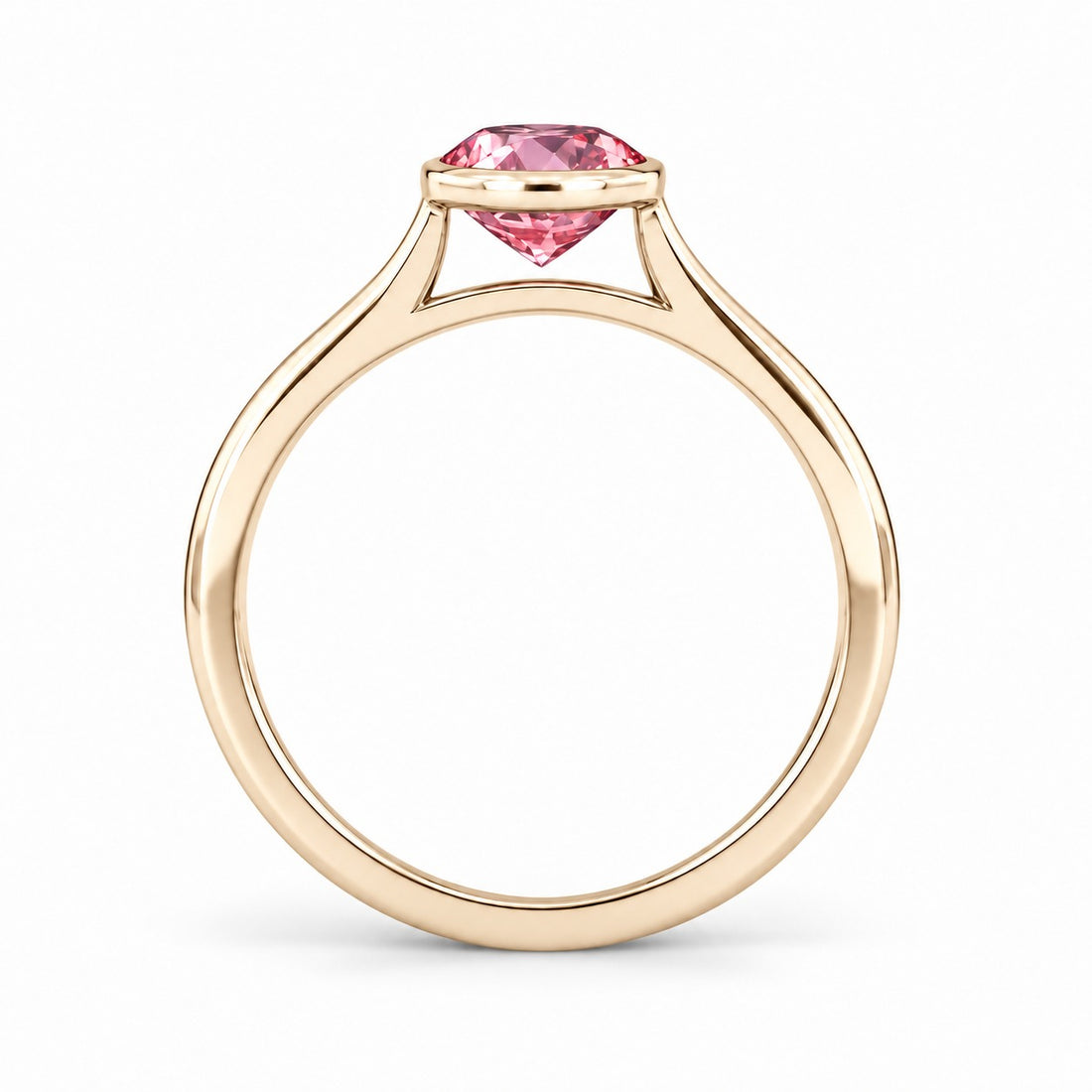 The Lune pink lab sapphire bezel solitaire ring in 14K yellow gold, profile view