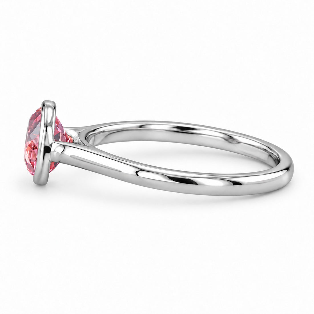 The Lune pink lab sapphire bezel solitaire ring in platinum, side view