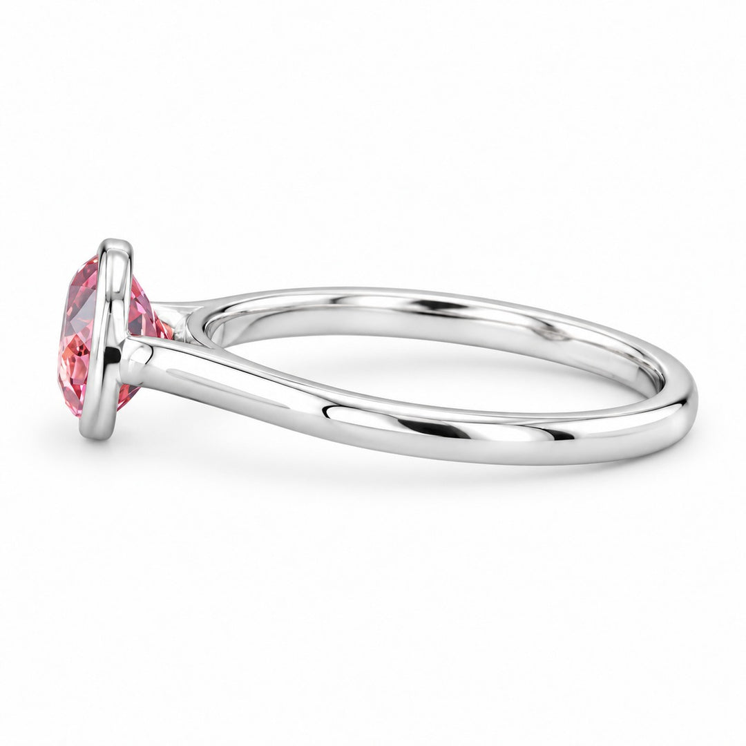 The Lune pink lab sapphire bezel solitaire ring in 14K white gold, side view