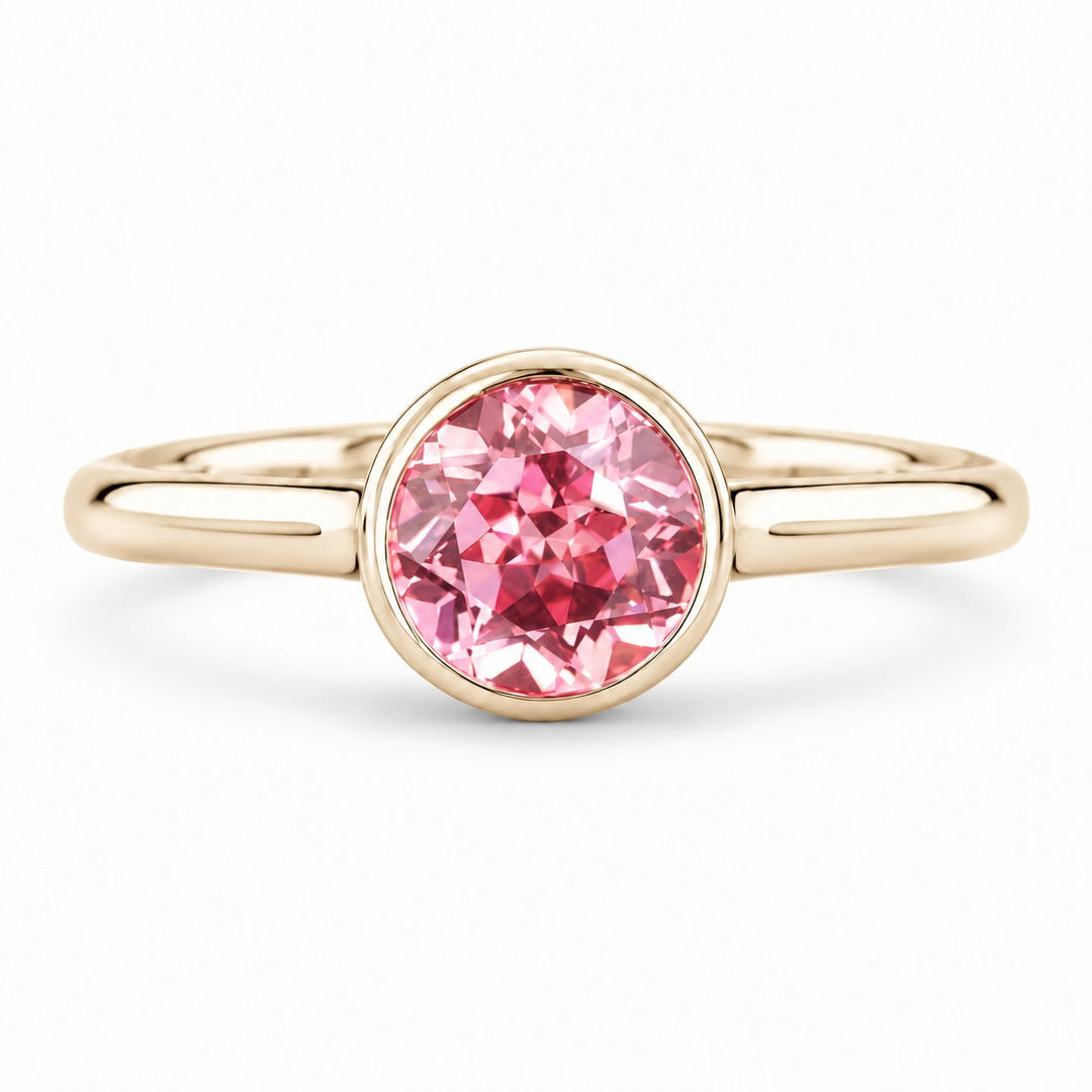 The Lune — Pink Round Sapphire Bezel Solitaire Ring in 14K yellow gold, front view
