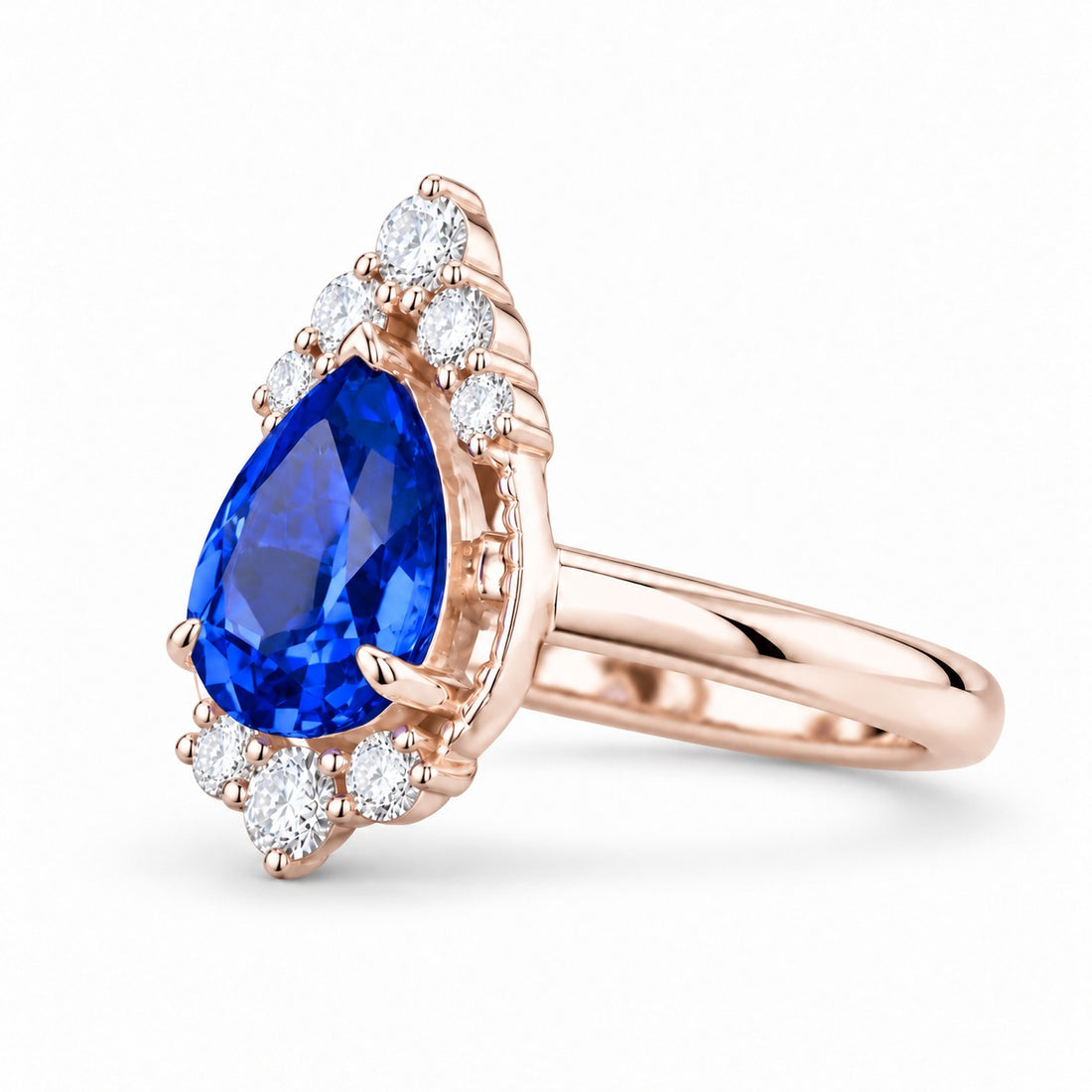 The Teardrop pear blue sapphire ring with diamond halo in 14K rose gold, angled view