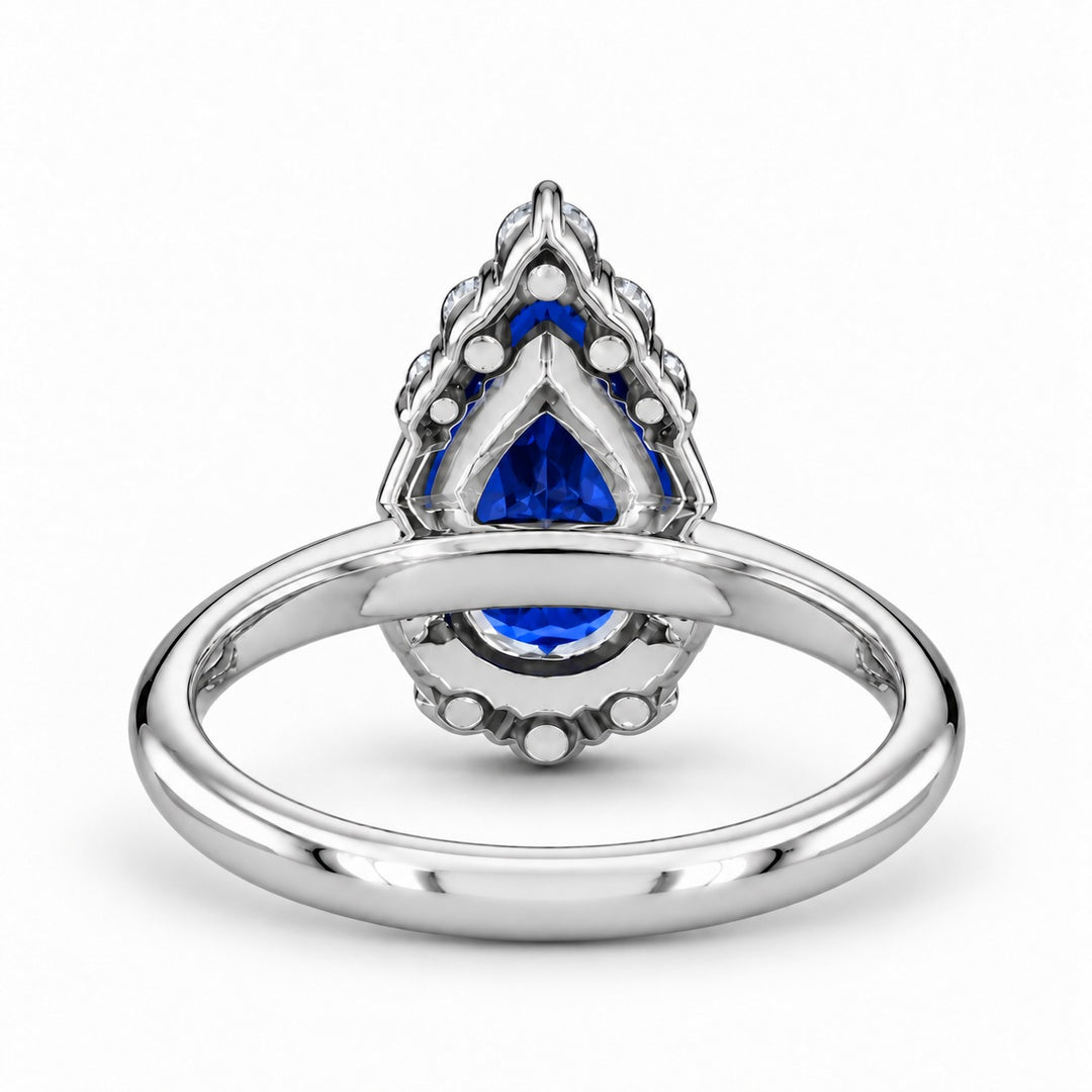 The Teardrop pear blue sapphire ring with diamond halo in platinum, back view