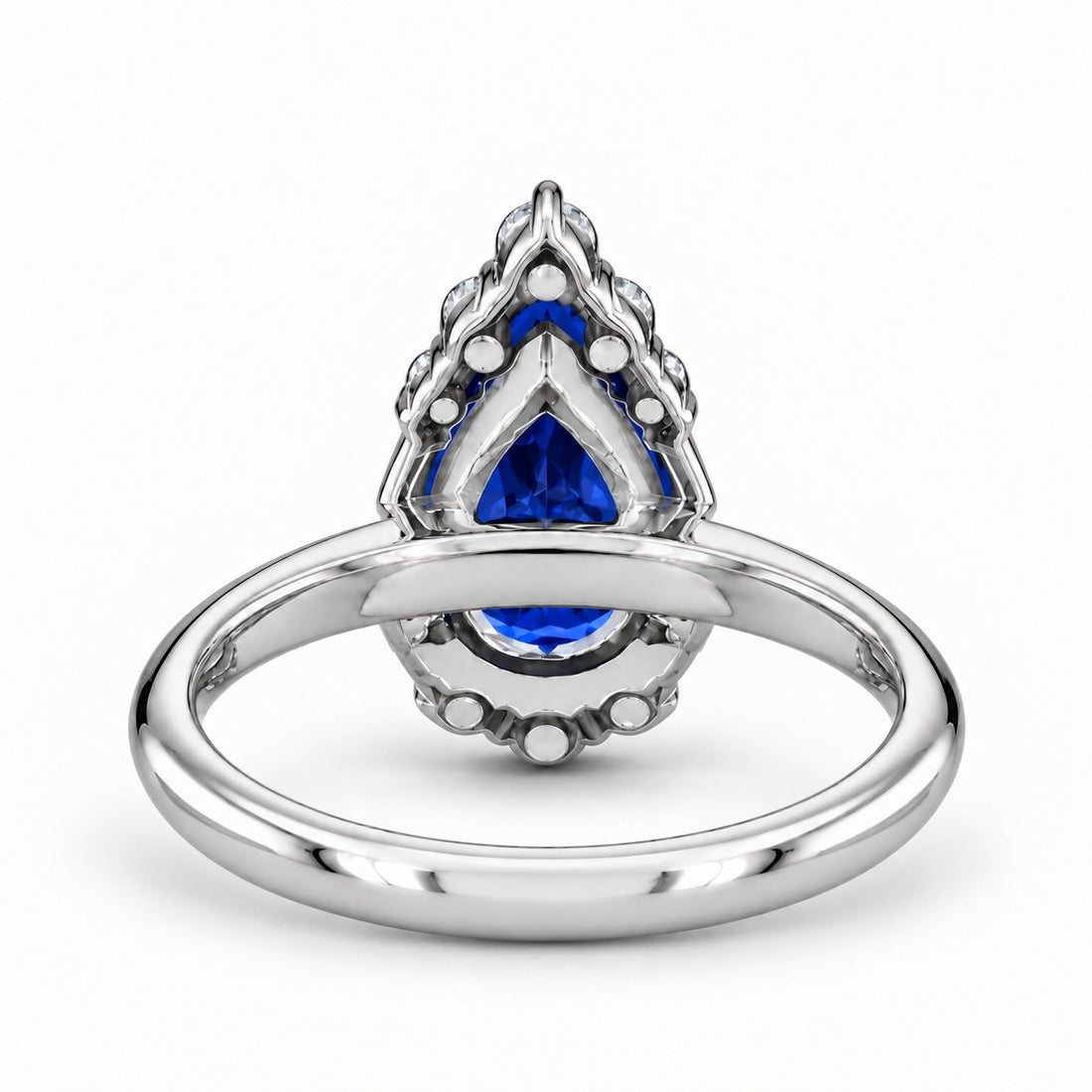 The Teardrop pear blue sapphire ring with diamond halo in platinum, back view