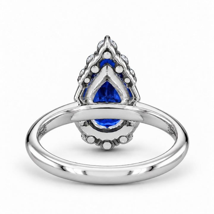 The Teardrop pear blue sapphire ring with diamond halo in platinum, back view