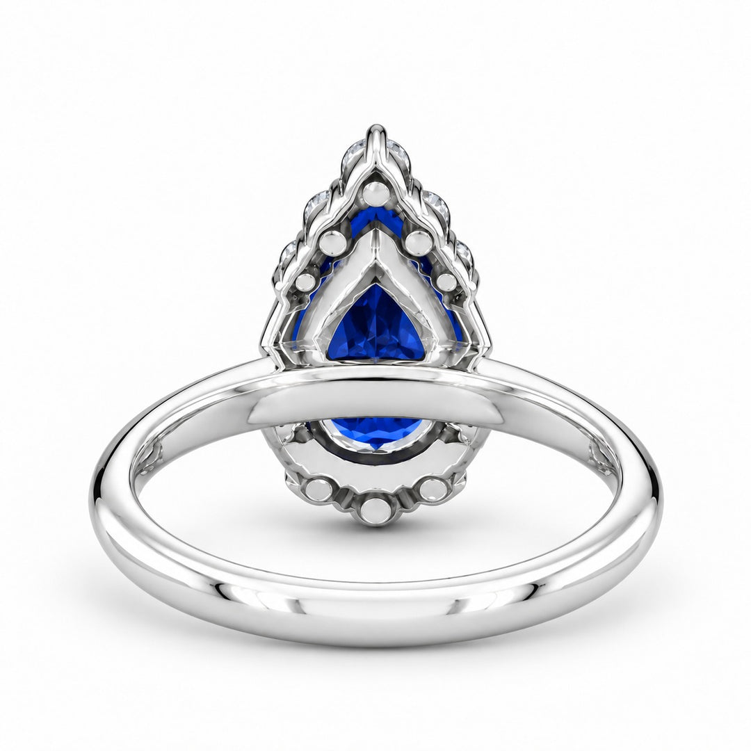 The Teardrop pear blue sapphire ring with diamond halo in 14K white gold, back view