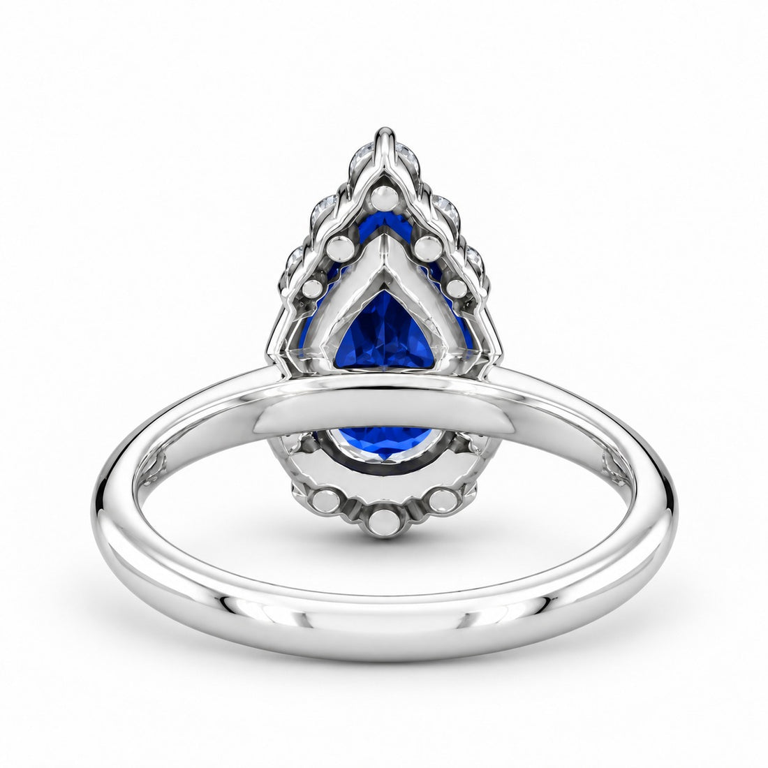 The Teardrop pear blue sapphire ring with diamond halo in 14K white gold, back view
