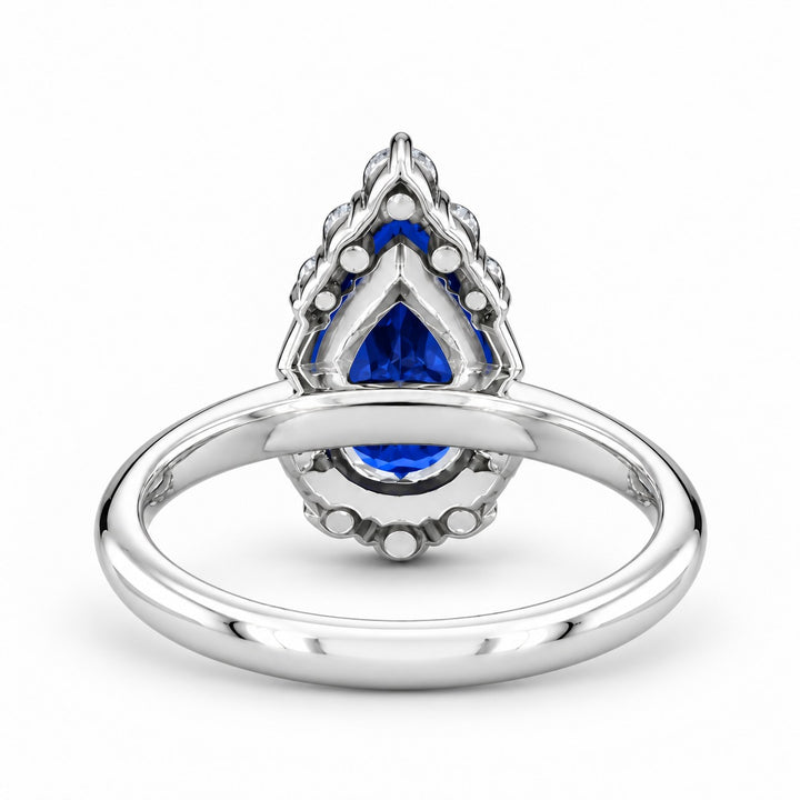 The Teardrop pear blue sapphire ring with diamond halo in 14K white gold, back view