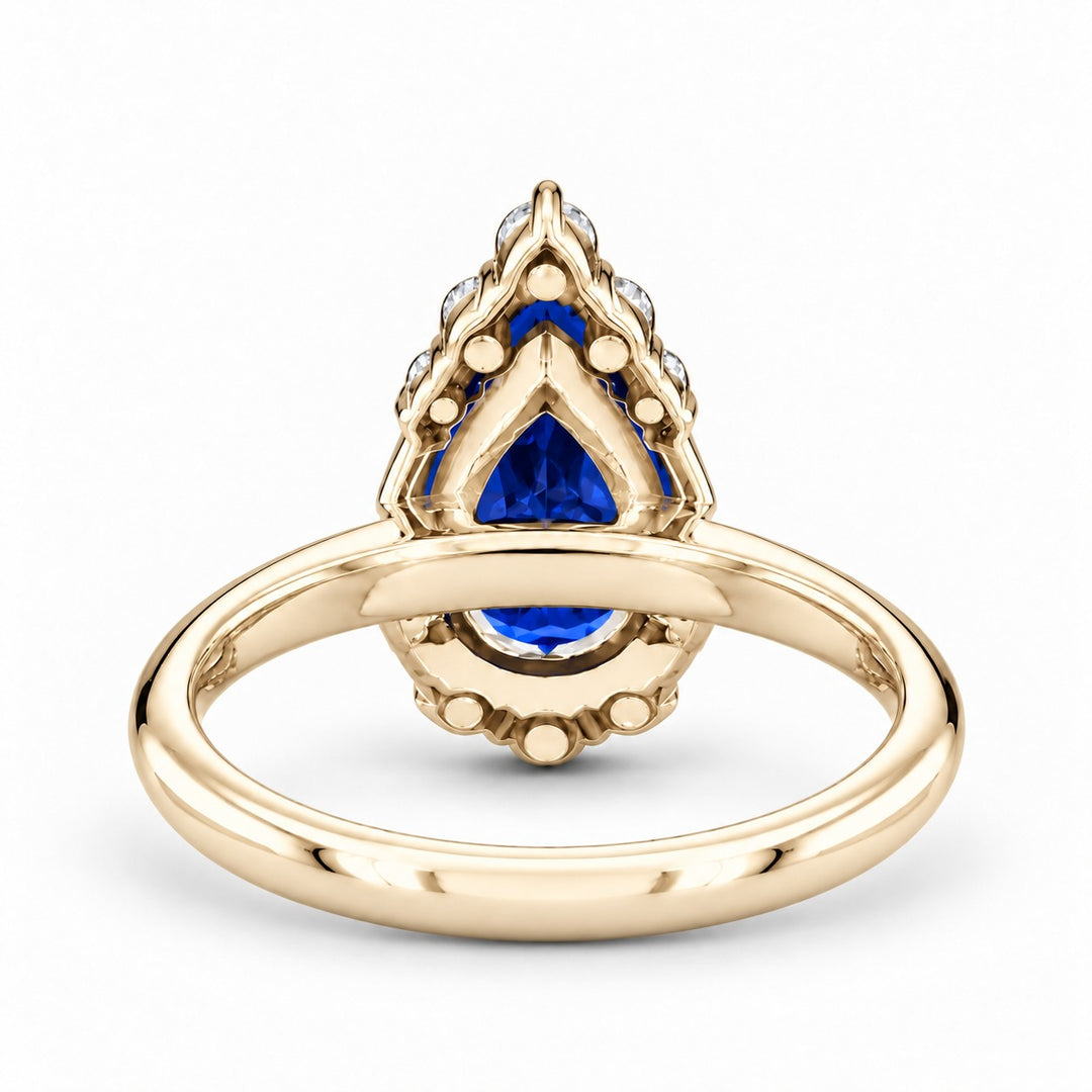 The Teardrop pear blue sapphire ring with diamond halo in 14K yellow gold, back view