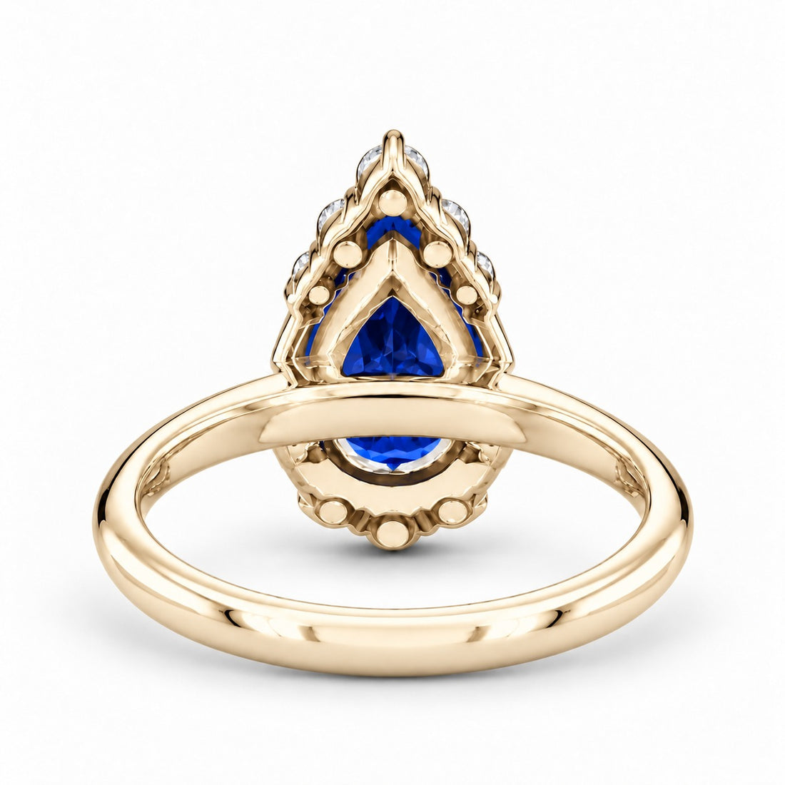 The Teardrop pear blue sapphire ring with diamond halo in 14K yellow gold, back view