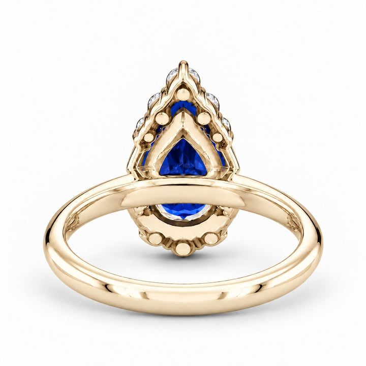 The Teardrop pear blue sapphire ring with diamond halo in 14K yellow gold, back view