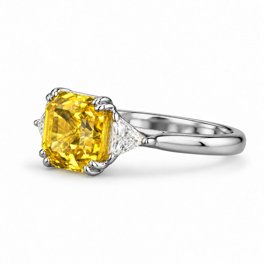The Sundial asscher yellow lab sapphire three-stone ring in platinum, angled view