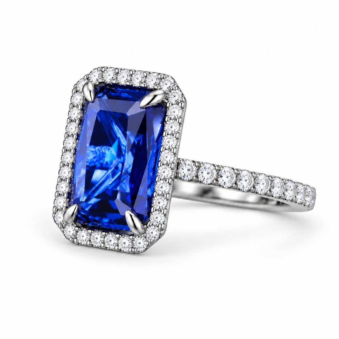 The Regalia emerald-cut lab sapphire halo ring in platinum, angled view