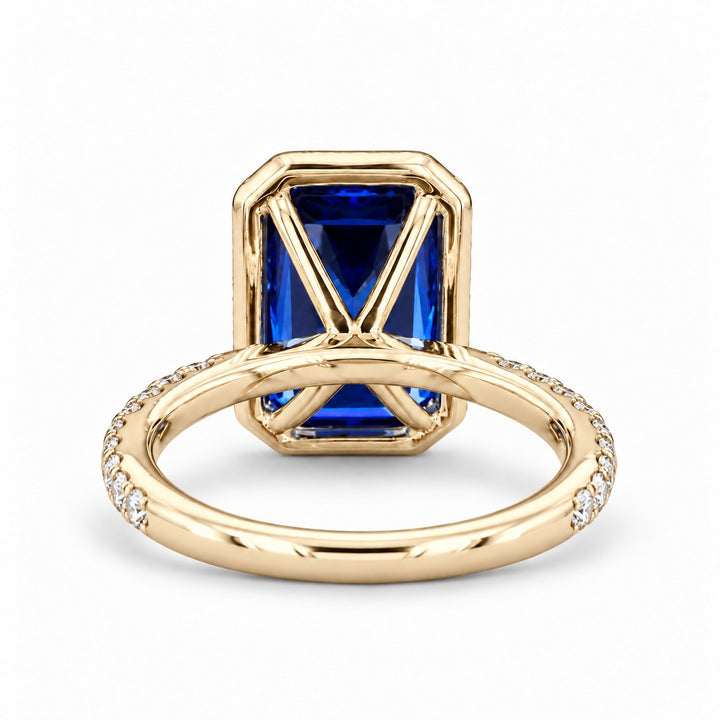The Regalia emerald-cut lab sapphire halo ring in 14K yellow gold, back view