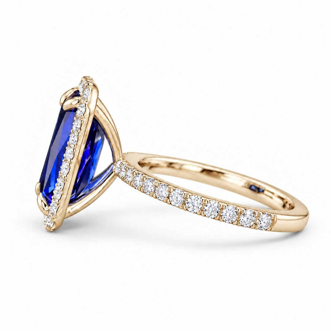 The Regalia emerald-cut lab sapphire halo ring in 14K yellow gold, side view