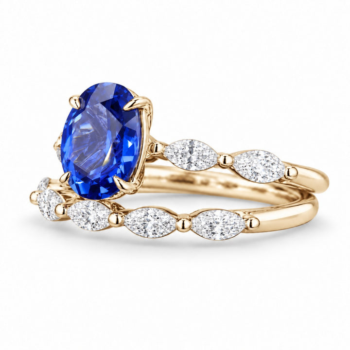 The Maeve Set oval lab sapphire ring and band in 14K yellow gold, angled view