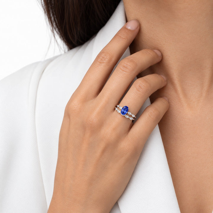 The Maeve Set oval lab sapphire ring and band in 14K white gold, worn on hand