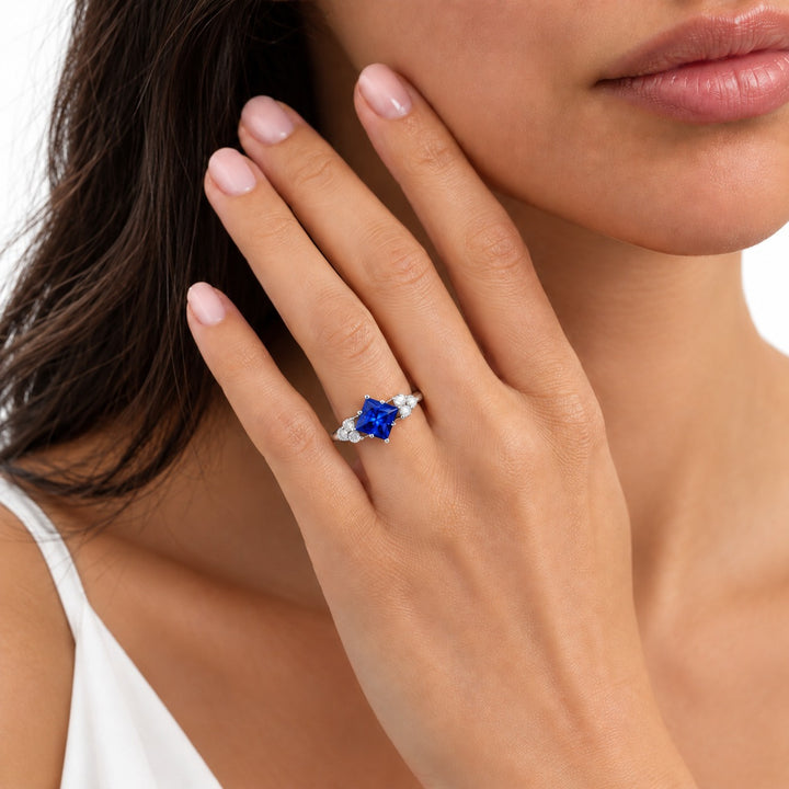 The Vesper princess lab sapphire ring in platinum, worn on hand