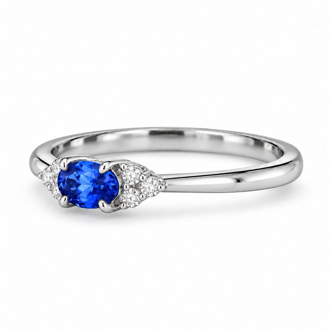 The Wren east-west oval blue sapphire ring in platinum, angled view