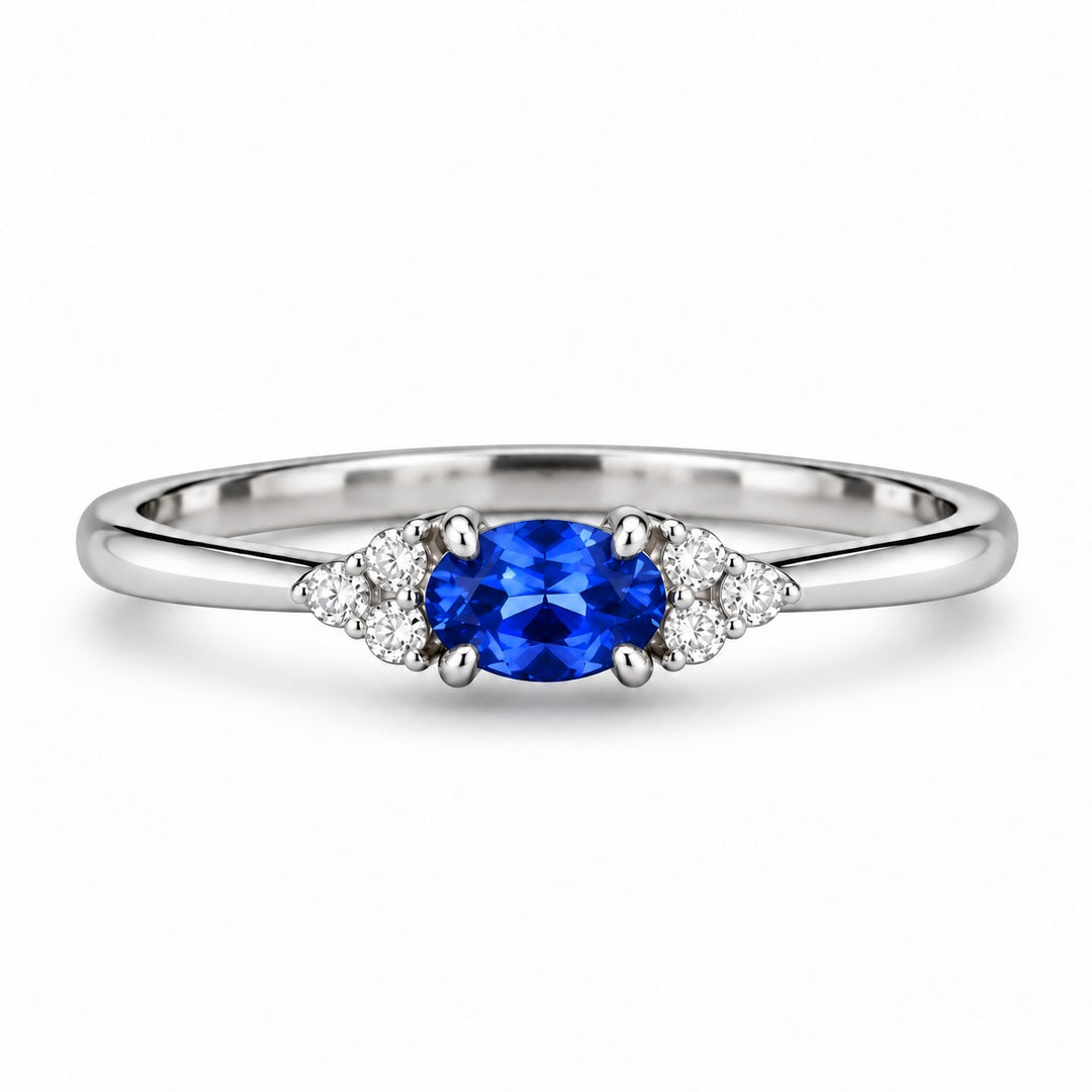 The Wren — Blue Oval Sapphire with Diamond Accents Ring in platinum, front view