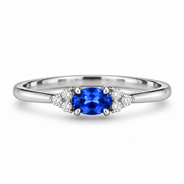 The Wren — Blue Oval Sapphire with Diamond Accents Ring in platinum, front view