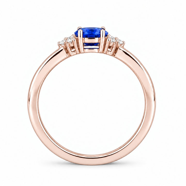 The Wren east-west oval blue sapphire ring in 14K rose gold, profile view