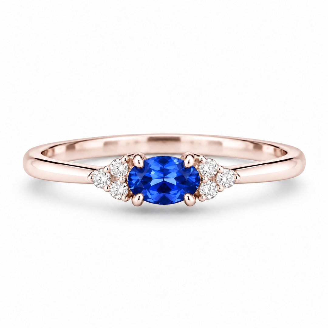 The Wren — Blue Oval Sapphire with Diamond Accents Ring in 14K rose gold, front view