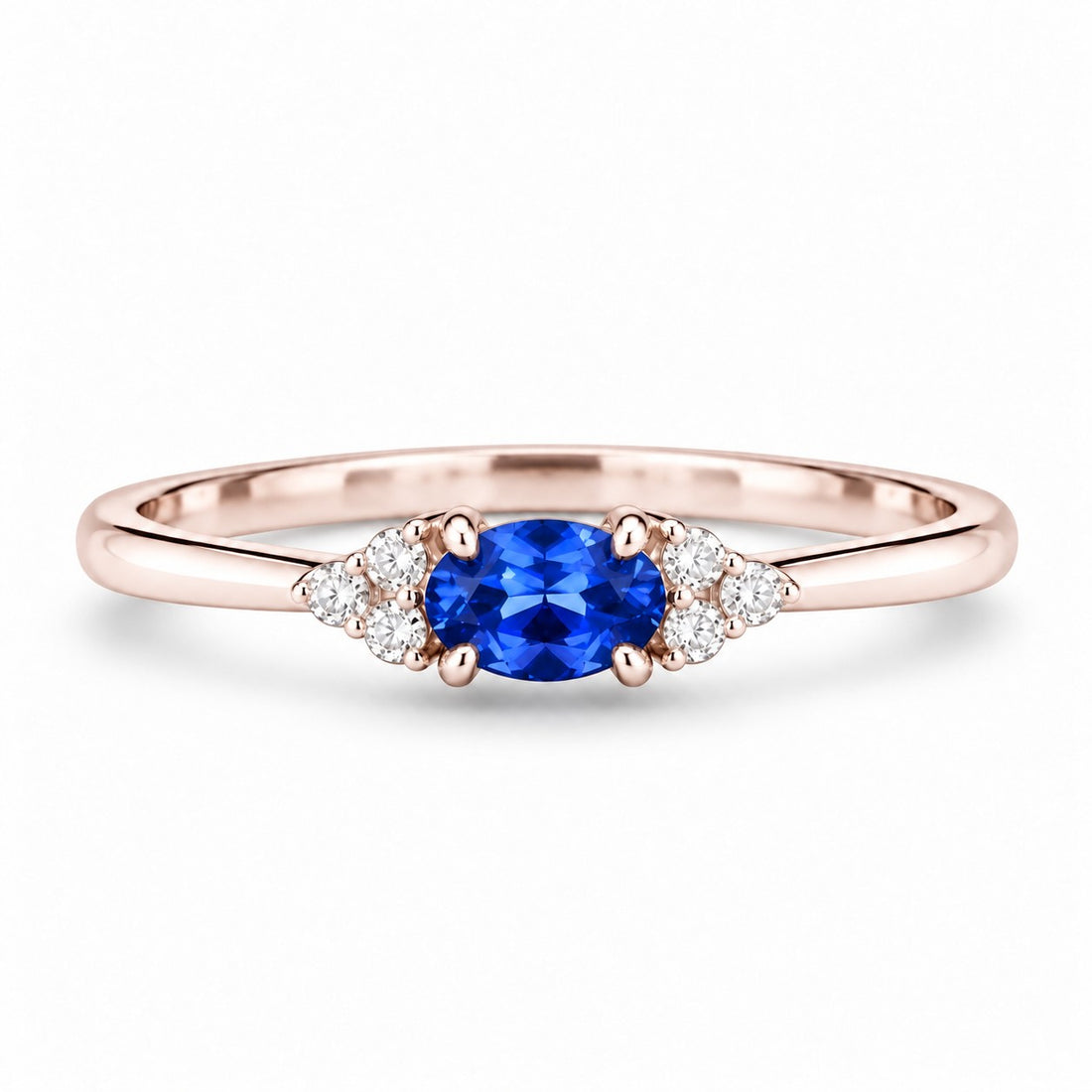 The Wren — Blue Oval Sapphire with Diamond Accents Ring in 14K rose gold, front view