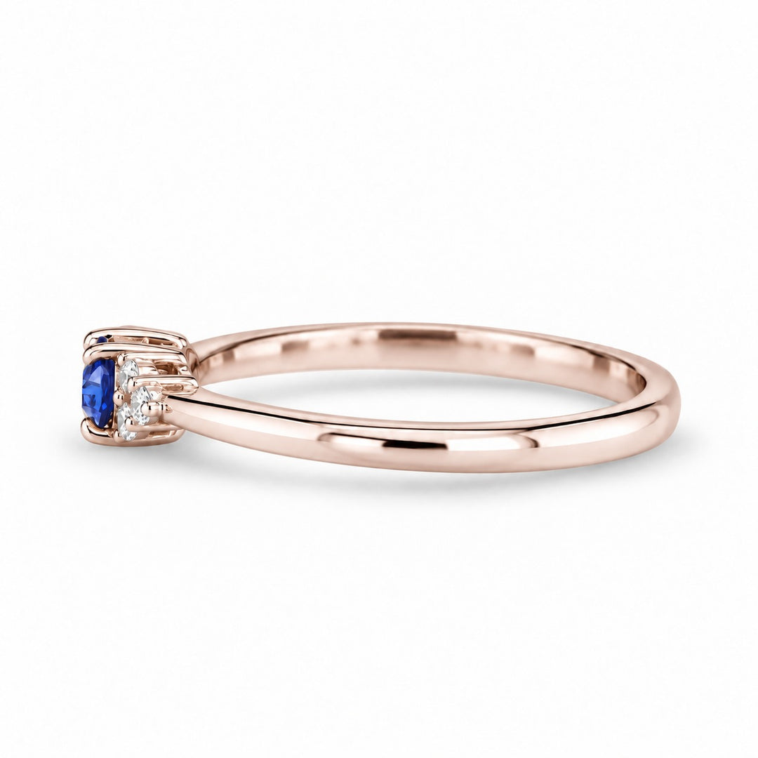 The Wren east-west oval blue sapphire ring in 14K rose gold, side view