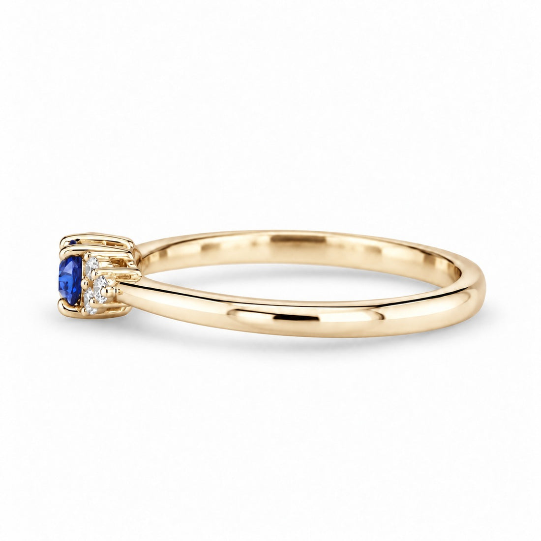The Wren east-west oval blue sapphire ring in 14K yellow gold, side view