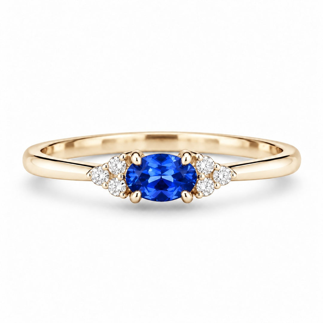 The Wren — Blue Oval Sapphire with Diamond Accents Ring in 14K yellow gold, front view