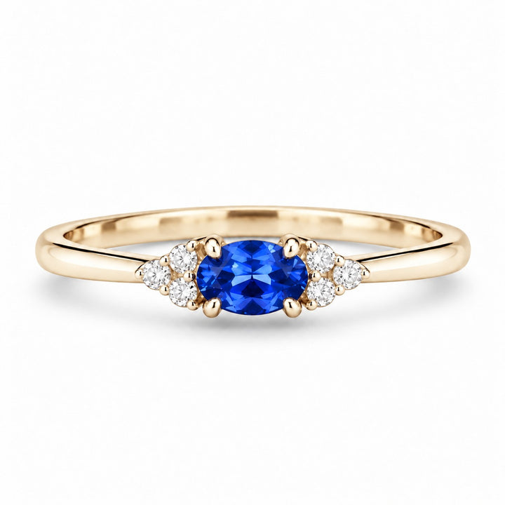 The Wren — Blue Oval Sapphire with Diamond Accents Ring in 14K yellow gold, front view