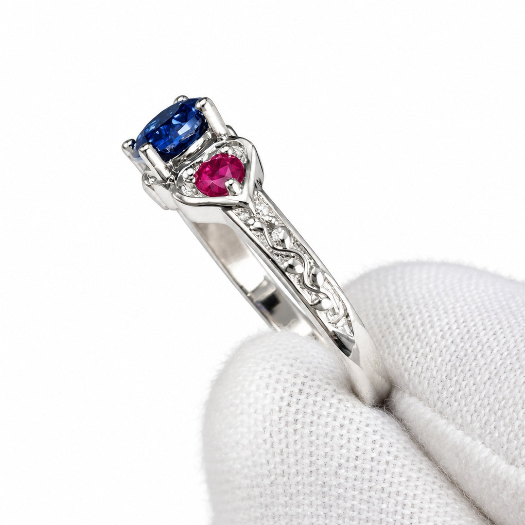 Sapphire and ruby three-stone ring with leaf band in 14K white gold, detail view