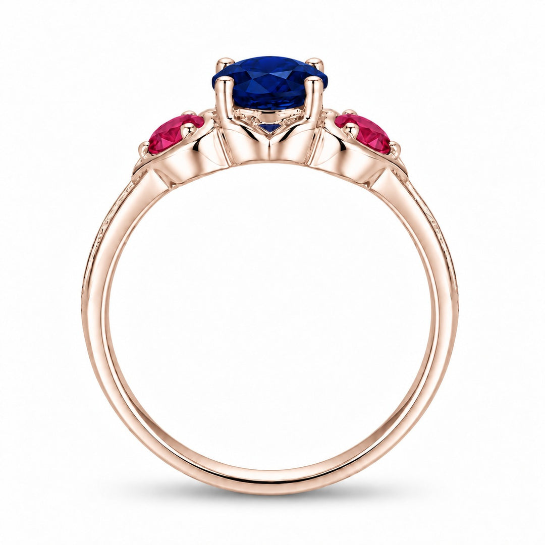 Sapphire and ruby three-stone ring with leaf band in 14K rose gold, profile view