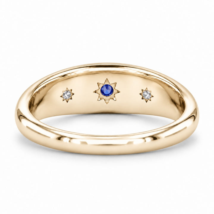 The Stella blue sapphire star-set dome band in 14K yellow gold, back view