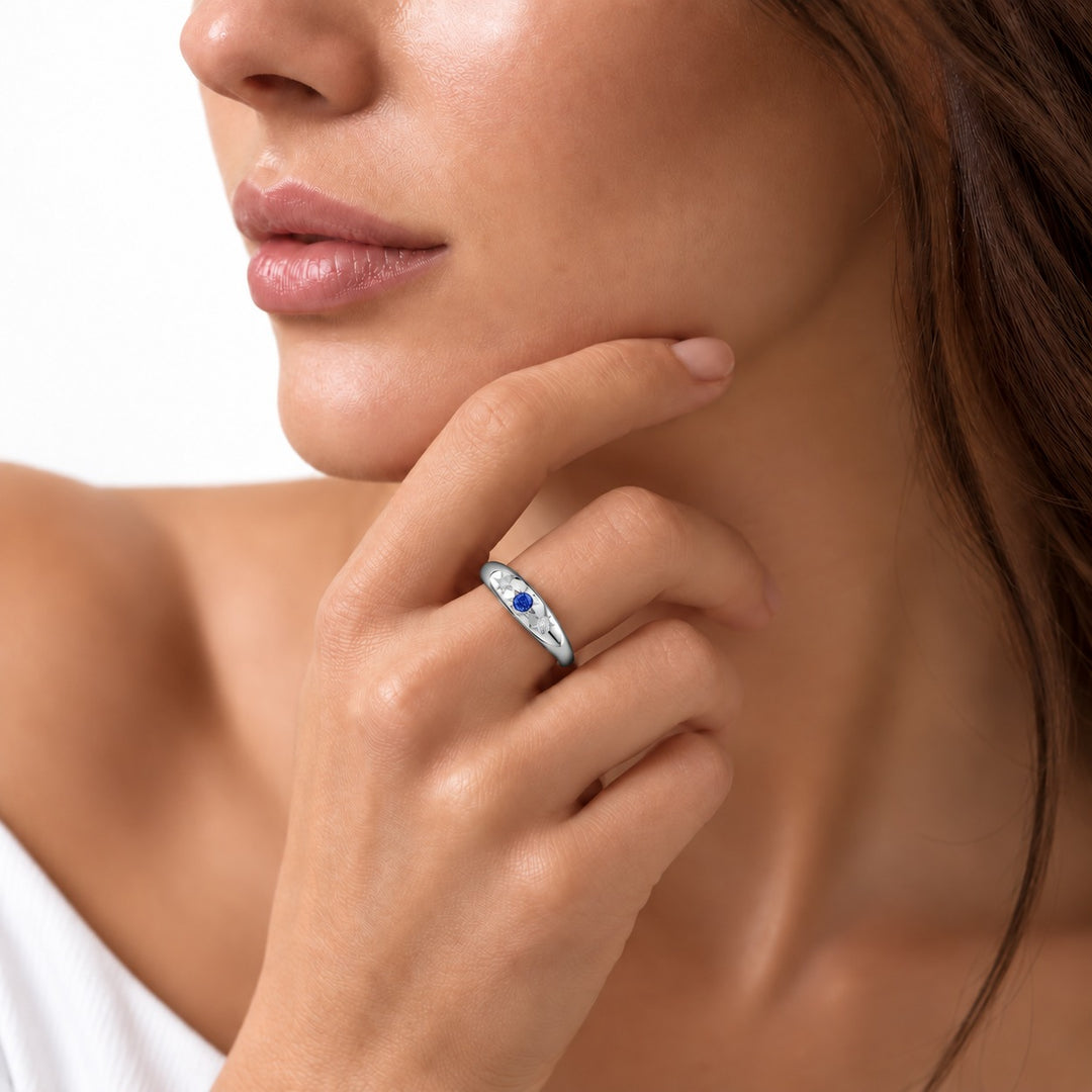 The Stella blue sapphire star-set dome band in platinum, worn on hand