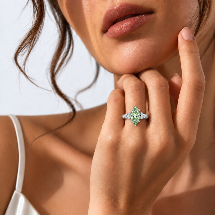 The Sovereign Crest with a green lab-grown marquise diamond in 14K white gold, on the hand