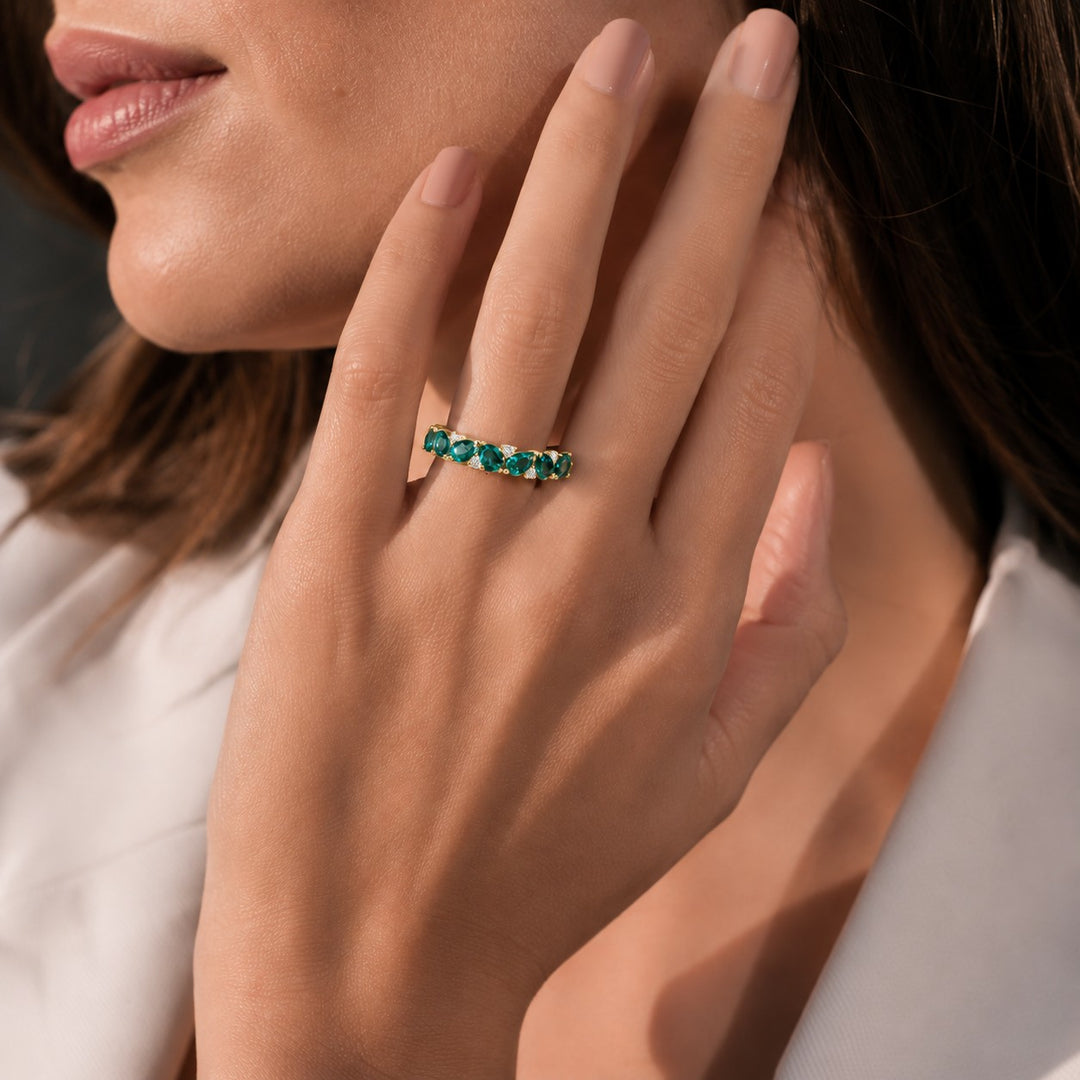 Pear Colombian Emerald & Round Diamond Eternity Band (3.5mm, 1.78ctw) worn on the hand in 14K Yellow Gold